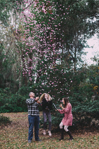 Blue confetti burst from air-powered gender reveal cannon
