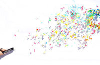 Confetti cannon firing multicolor paper confetti 20 feet